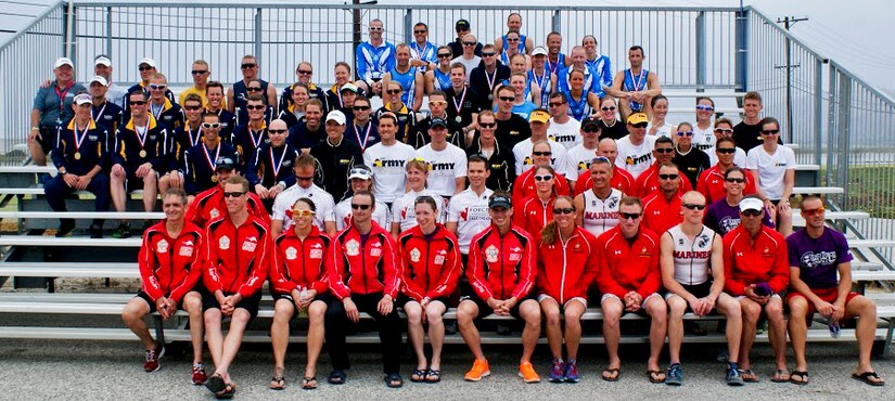 Competitors from the U.S. Air Force, Army, Marines, Navy, and athletes from the Canadian military forces sit together after the Armed Forces Triathlon, June 1, 2013, at Naval Base Ventura County, Point Mugu, Calif. The triathlon was an “Olympic” distance triathlon, consisting of nearly a mile swim, 24.8-mile bicycle ride and 6.2 mile run. (Courtesy photo/Released)