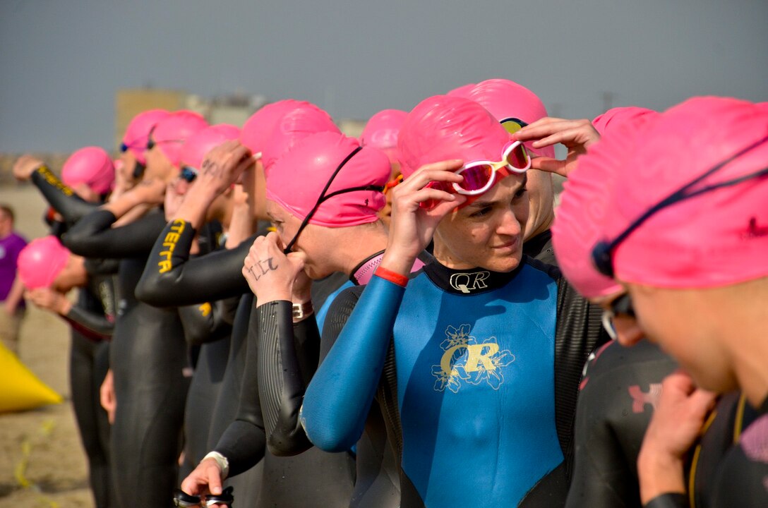 Female Service members line up ready to jump into the Pacific Ocean for the first leg of the Armed Forces Triathlon, June 1, 2013, at Naval Base Ventura County, Point Mugu, Calif. The event featured male and female competitors from the U.S. Air Force, Army, Marines, Navy, and athletes from the Canadian military forces.  (U.S. Army courtesy photo by Fred Morgan/Released)