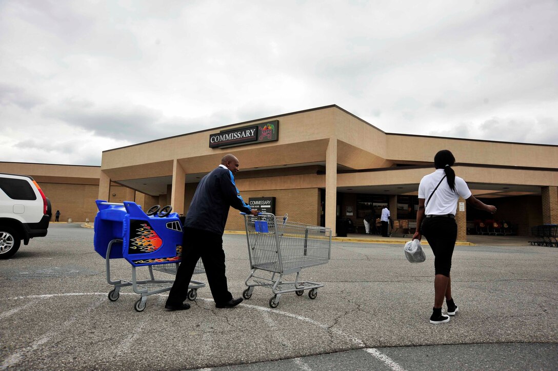 Workers at the Joint Base Andrews Commissary gather shopping carts from the parking lot June 17, 2013.  The Andrews Commissary is slated to close on Mondays from July 8 through Sept. 30 due to a sequester-driven furlough of DoD civilian employees. (U.S. Air Force photo/Staff Sgt. Torey Griffith)