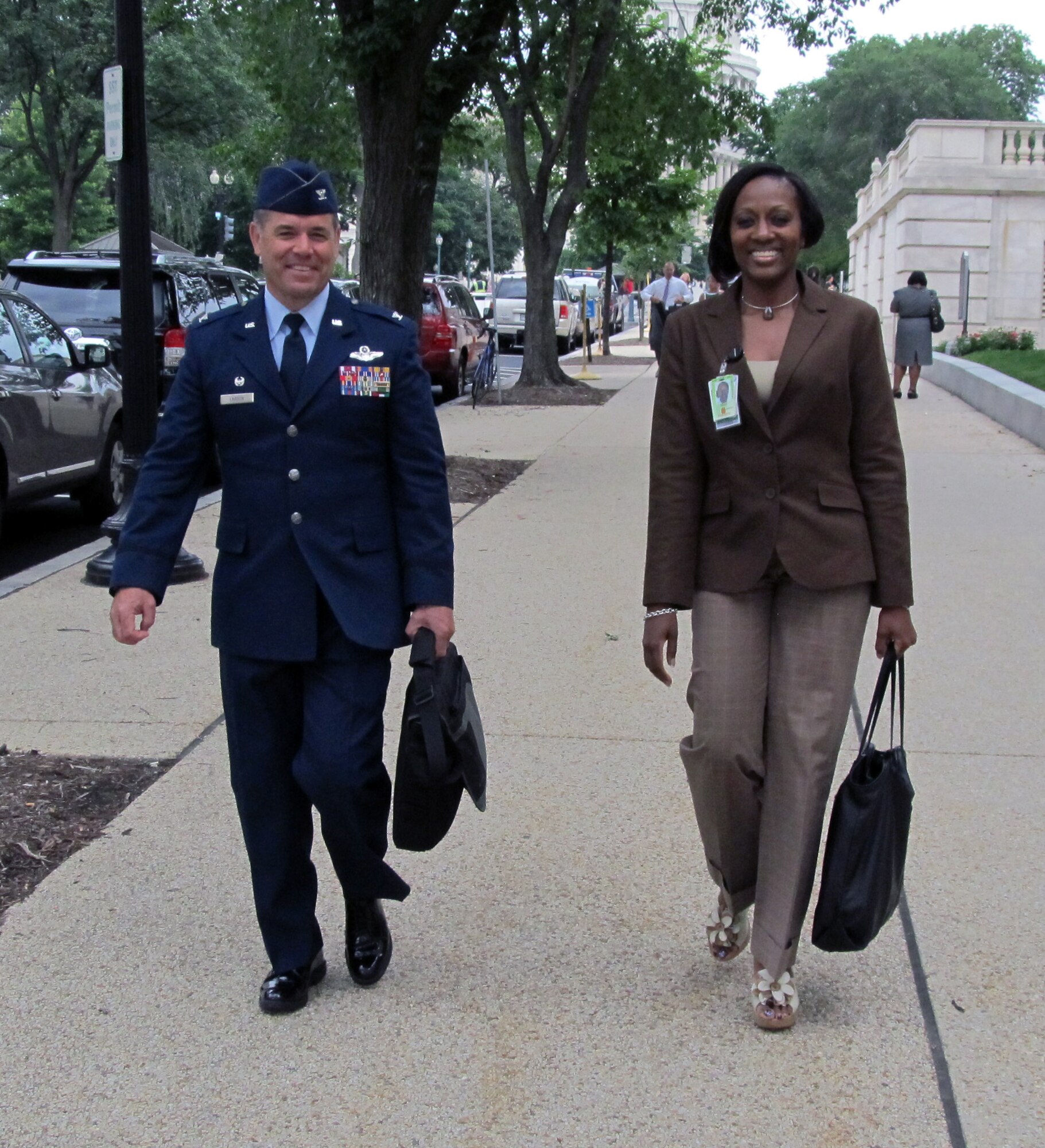 Col. Mark S. Larson, commander of the Air Force Reserve 931st Air Refueling Group, McConnell Air Force base, Kan., and his legislative escort for the day, Chief Master Sgt. Desriann Stevens, chief of policy integration, make their way through Capitol Hill as Larson conducts visits with congressional members, June 19, 2013.  Larson participated in the Commander's Capitol Hill Visit Program, a program through which commanders of Air Force units visit with congressional members to discuss issues that affect Airmen as well as their units.  (U.S. Air Force photo by Capt. Zach Anderson)