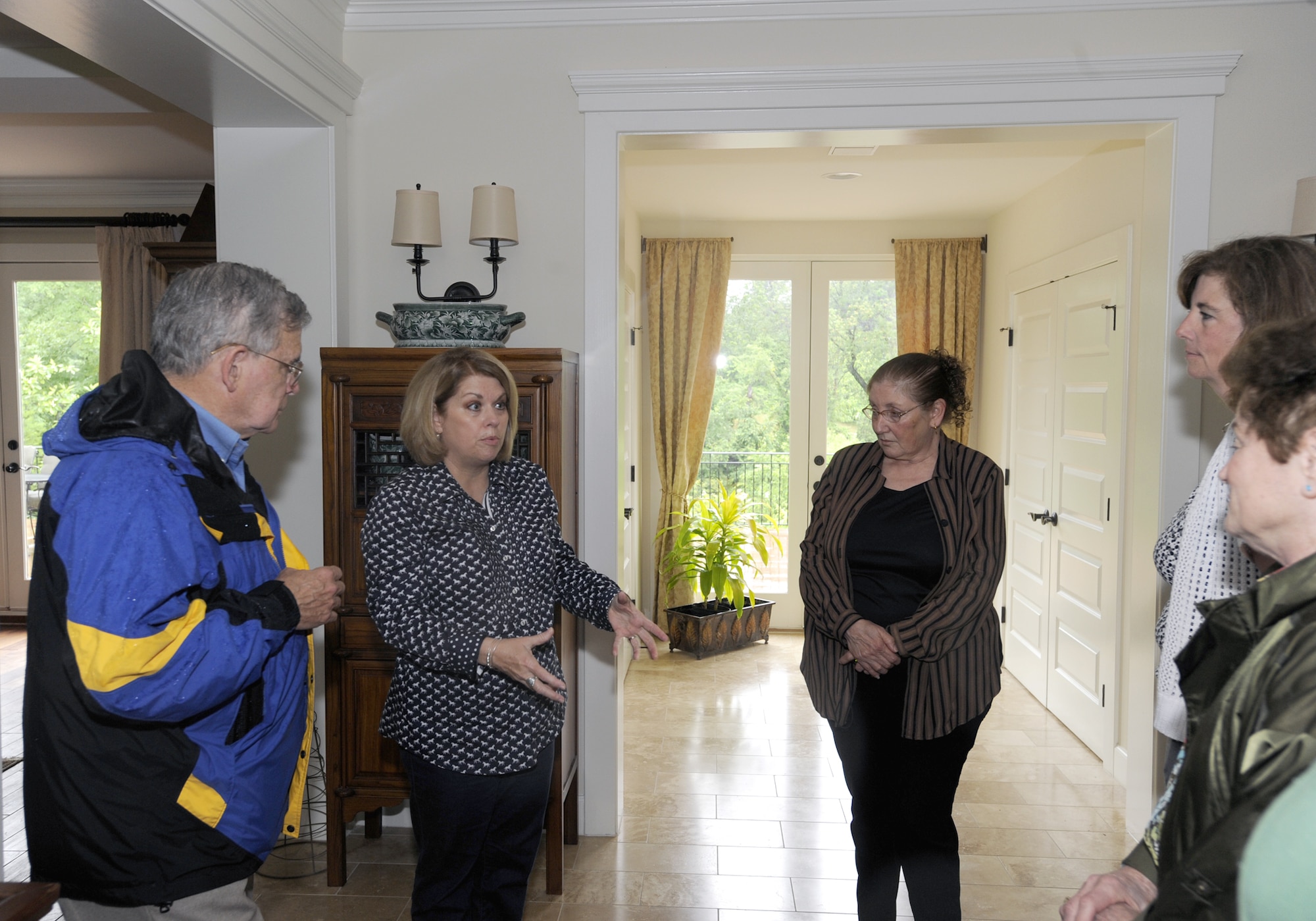 Sharon Gorenc ,wife of Lt. Gen. Frank Gorenc, assistant vice chief of staff and director, Air Staff, Headquarters, U.S. Air Force, welcomes the Darcey family descendants, Maj. Gen. Gary Curtin, (Ret.) Ms. Lee Green, center,  Shelly Muffley and Mrs. Karen Curtin to Belle Chance during a visit to the Darcey family gravesite at Belle Chance located on Joint Base Andrews, Md. , on June 7, 2013. (U.S. Air Force Photo/ Aletha Frost) 