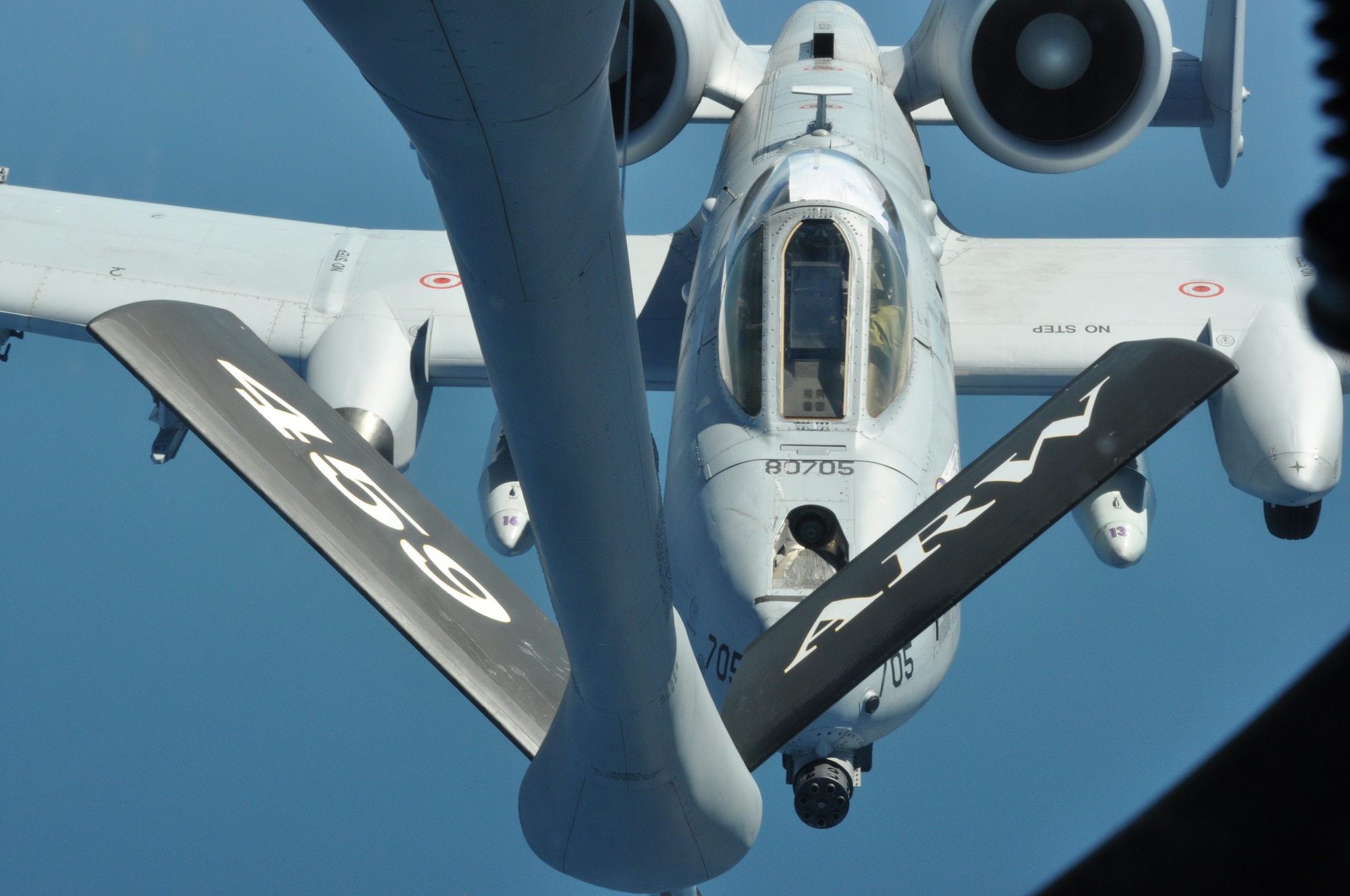 An Air National Guard A-10 Thunderbolt II fighter jet from the 175th Wing, Baltimore., pulls up under the boom, or fuel nozzle, of a KC-135 Stratotanker from the 459th Air Refueling Wing, Joint Base Andrews, Md., during a mission which refueled the A-10s from European countries back to the U.S., June 9, 2013. The crews also partnered with a tanker team from the 22 ARW, McConnell Air Force Base, Kan. All units involved belong to a Total Force Integration. (U.S. Air Force photo/ Staff Sgt. Katie Spencer) 