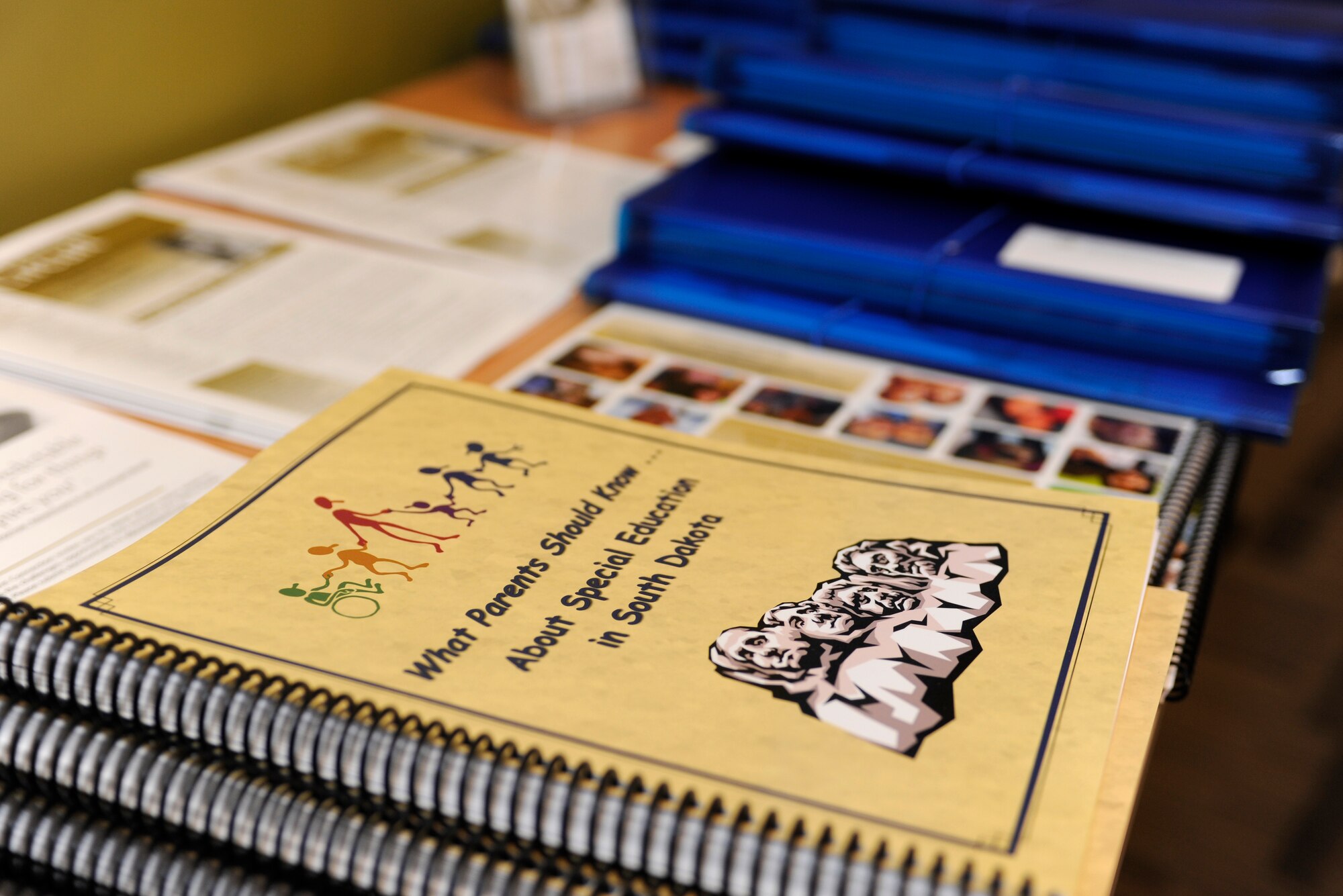 Literature, binders and other helpful tools are laid out for parents of children with disabilities or special needs during a Specialized Training of Military Parents workshop in Rapid City, S.D., June 14, 2013. The STOMP program was developed to teach parents of children with disabilities or special needs how to advocate for their children in the midst of a hectic, and often unpredictable, military lifestyle. (U.S. Air Force photo by Airman 1st Class Ashley J. Thum/Released)