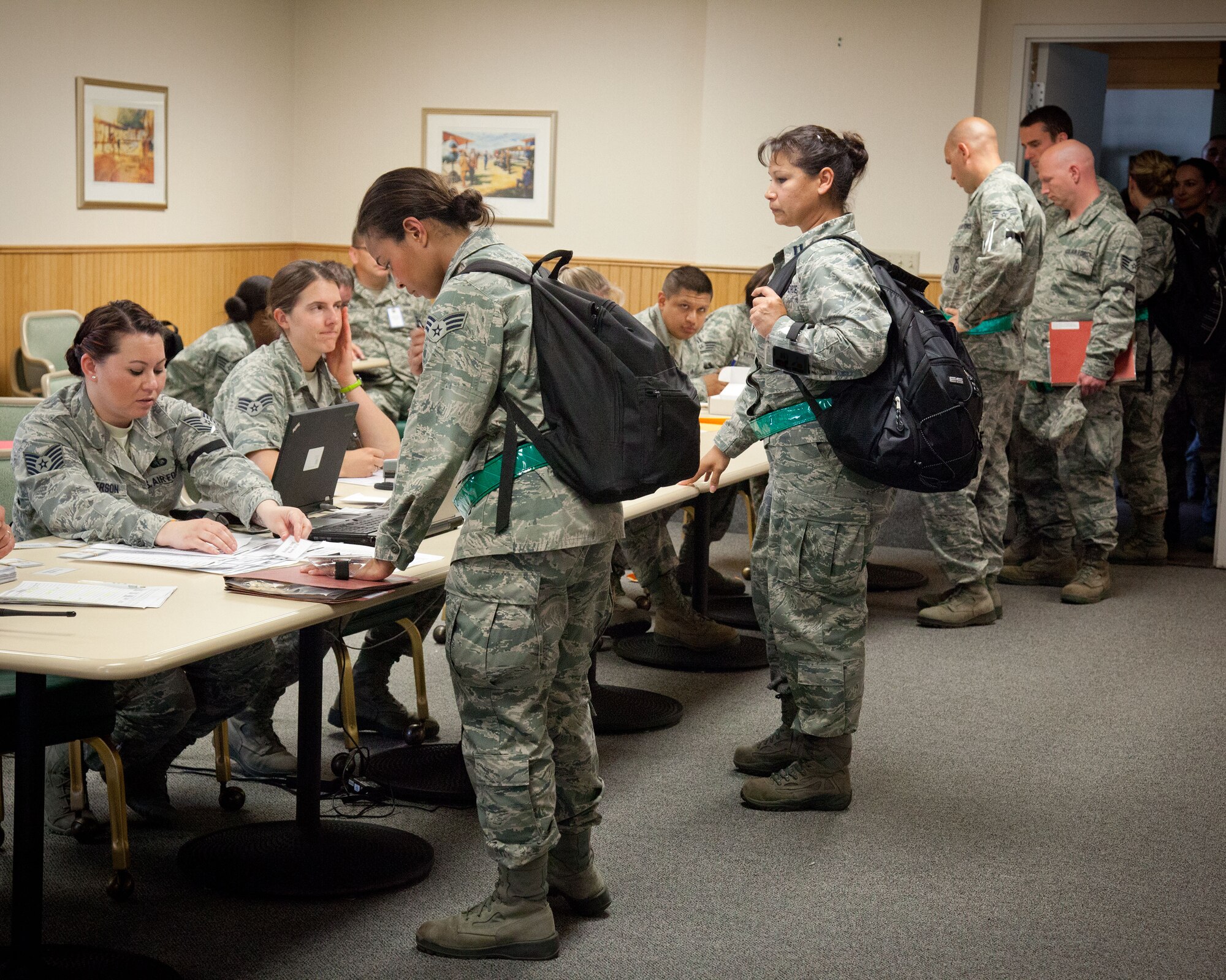 Airmen in-process at Personnel Support for Contingency Operations for a mock deployment.  Members of the 934th Airlift Wing participated in an Operational Readiness Exercise during the week of June 17-21 at the Minneapolis-St. Paul Air Reserve Station, Minn.  (U.S. Air Force photo/Shannon McKay)