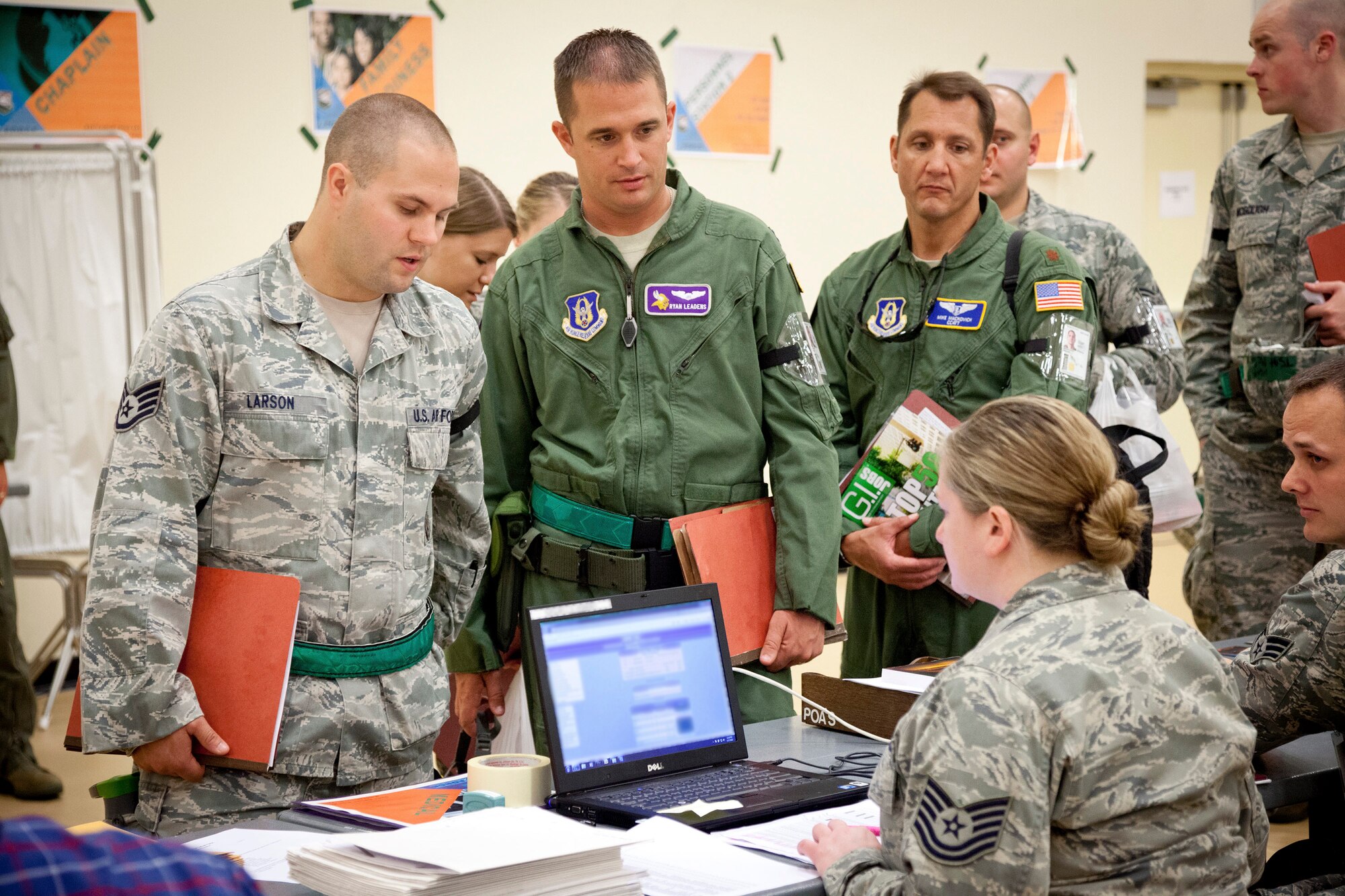 Tech. Sgt. Amanda Killebrew, 934th Aeromedical Staging Squadron, verifies the medical readiness of mock deploying Airmen in a Personnel Deployment Function line. Members of the 934th Airlift Wing participated in an Operational Readiness Exercise during the week of June17-21 at the Minneapolis-St. Paul Air Reserve Station, Minn.  (U.S. Air Force photo/Shannon McKay)
