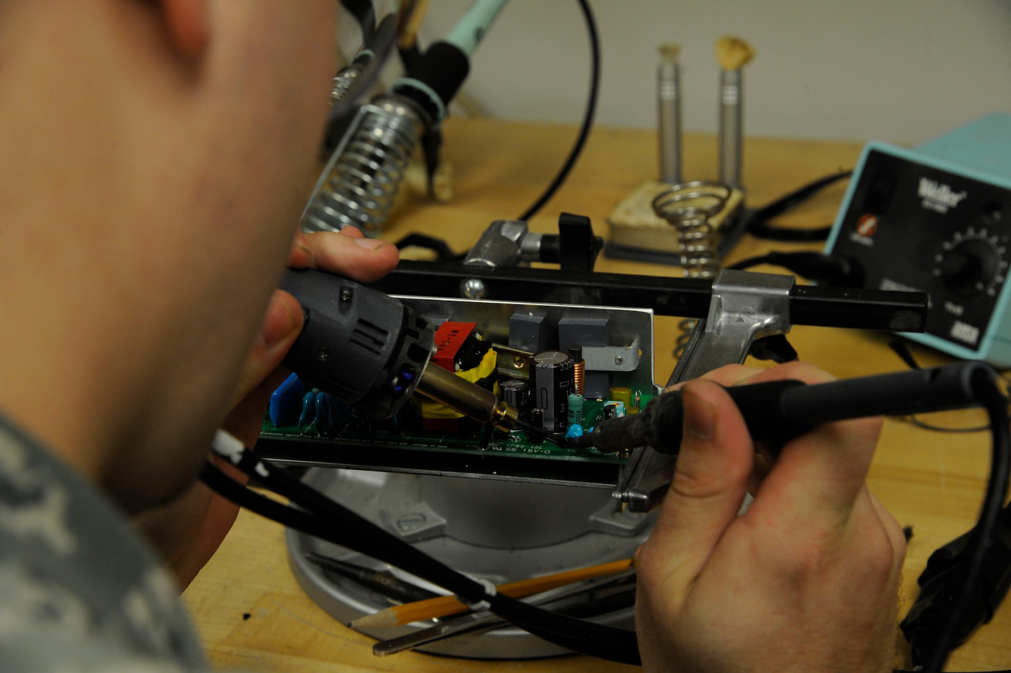 Staff Sgt. Andrew Bouck, 2nd Medical Support Squadron maintenance NCO in-charge, solders a circuit board on Barksdale Air Force Base, La., June 18, 2013. Biomedical Equipment Technicians ensure all equipment the 2nd Medical Group and 2nd Dental Squadron are up to date and kept in working order. Faulty or uncalibrated equipment can cause patients to be misdiagnosed, causing Barksdale's mission of delivering precision munitions to the battlefield to suffer. (U.S. Air Force photo/Airman 1st Class Andrew Moua)