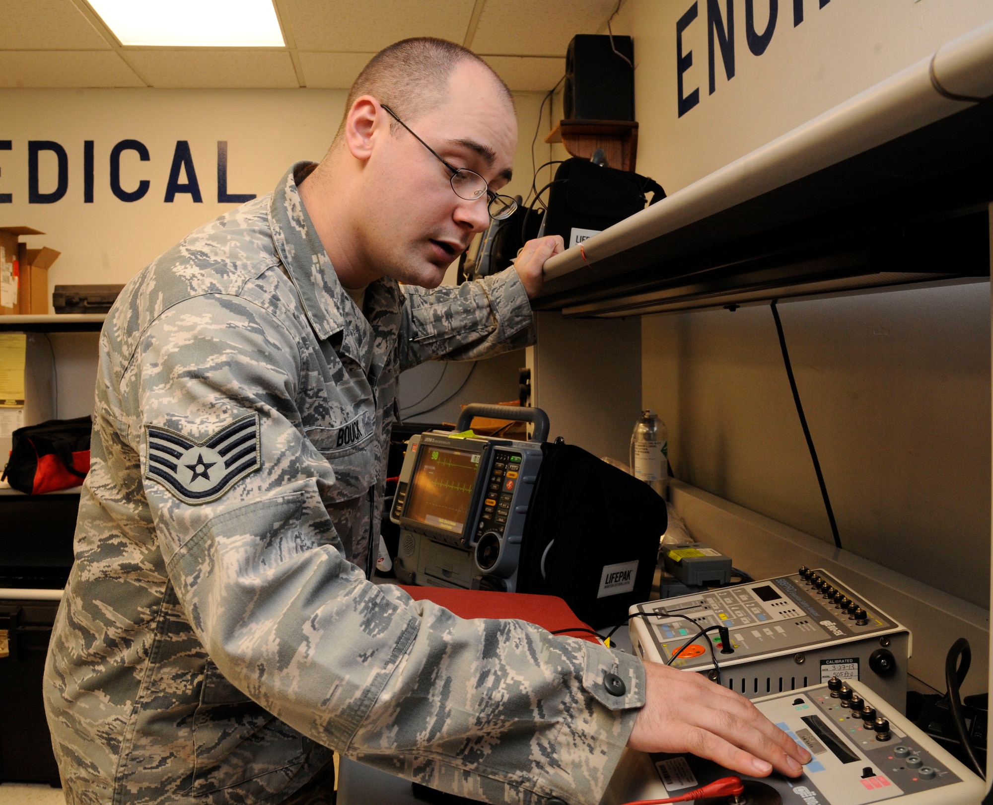 Staff Sgt. Andrew Bouck, 2nd Medical Support Squadron maintenance NCO in-charge, calibrates defibrillators on Barksdale Air Force Base, La., June 18, 2013. The Biomedical Equipment Technician section is in charge of more than 1,300 pieces of medical equipment they must maintain and ensure are serviceable. Equipment ranges from simple blood pressure cuffs to advanced X-ray machines. (U.S. Air Force photo/Airman 1st Class Andrew Moua)