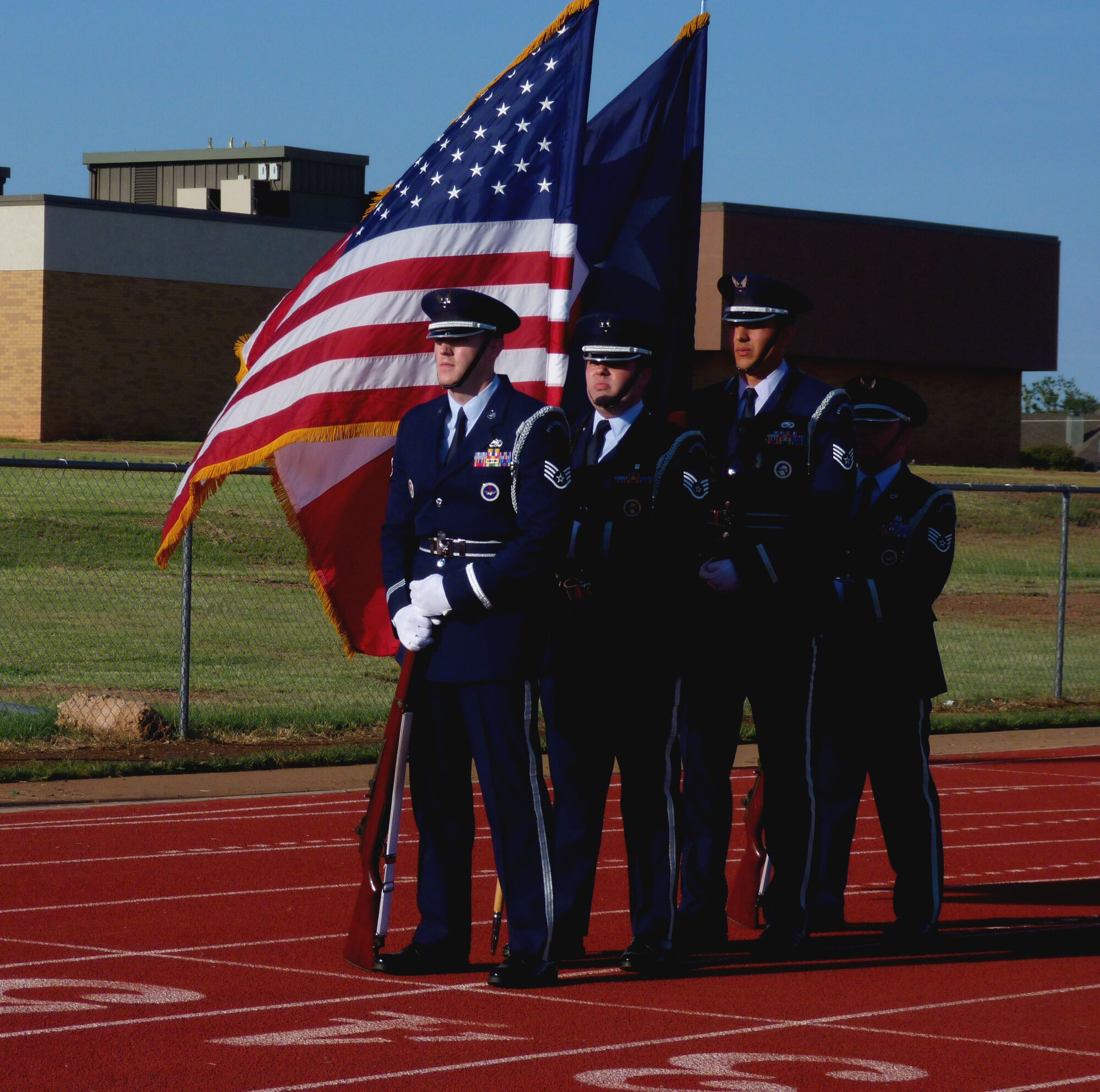 Sheppard Air Force Base Honor Guard prepares to present the colors at the annual Relay for Life in Wichita Falls. At the end of the closing ceremony, approximately $66,749 had been raised in the effort to fight cancer. (U.S. Air Force photo/Kimberly Goff /Released)