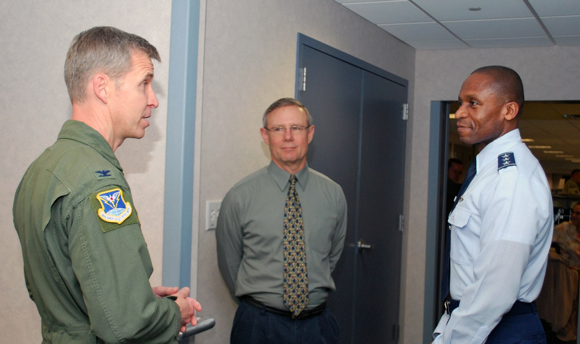 Col. Steve Hopkins, Director of the Mission Support Directorate, introduces Mr. David Bjornson, 618 Air and Space Operations Center’s Mission Support deputy director, to Lt. Gen. Darren McDew, 18th Air Force commander, during a visit to the AOC June 10, 2013. The Mission Support Directorate maintains the 618th AOC’s viability today and develops solutions for tomorrow's challenges. The directorate is comprised of three divisions providing timely, accurate and relevant data, technology and resource support. (U.S. Air Force photo by 1st Lt. Nicole White)