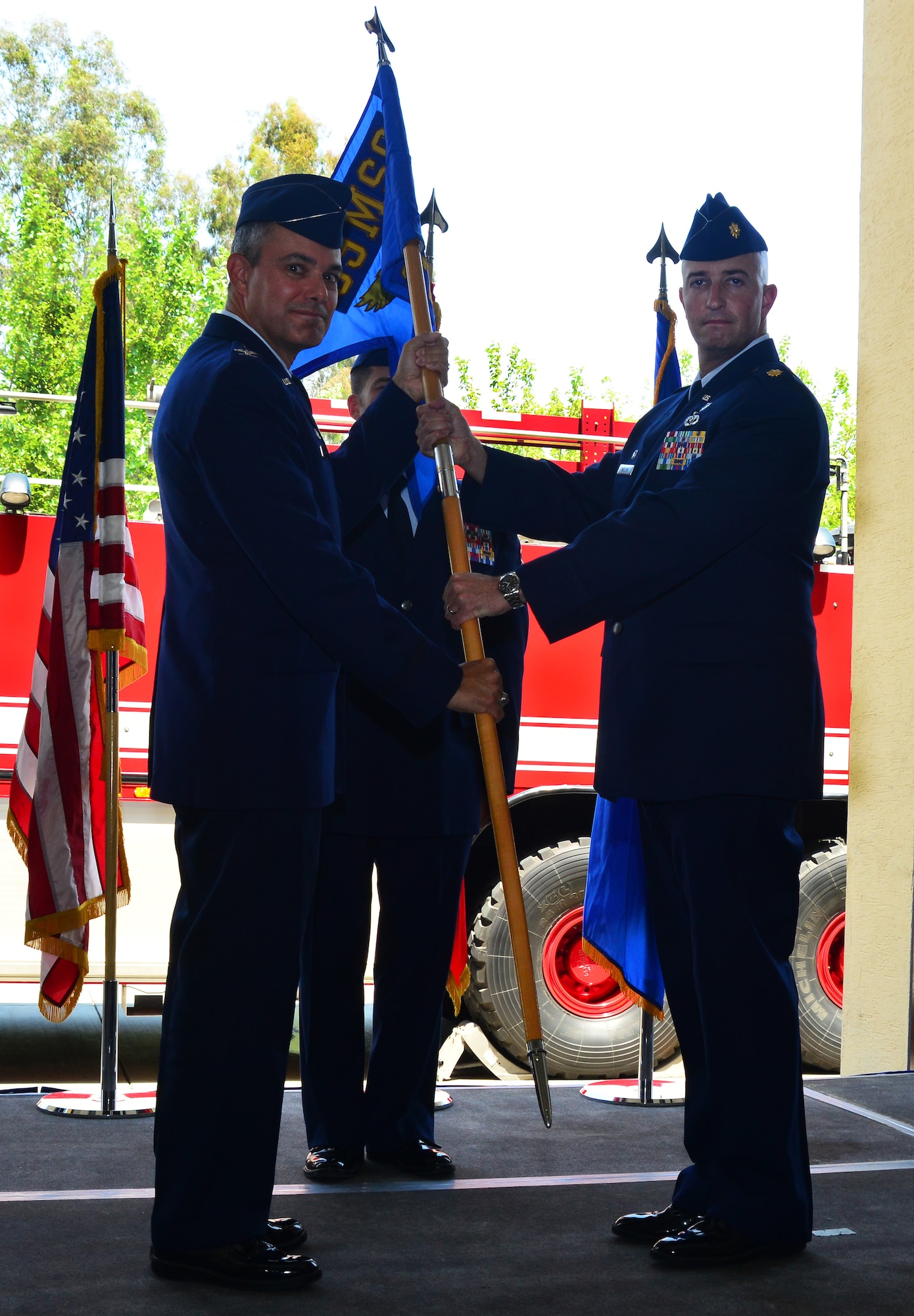 Col. Sean Gallagher, 39th Mission Support Group commander, pass the 39th Civil Engineer Squadron guidon to Maj. Matthew Welling, 39th CES commander, during the 39th CES change of command ceremony June 17, 2013, at Incirlik Air Base, Turkey. The exchange of the guidon represents the transition of power from one commander to the next. (U.S. Air Force photo by Staff Sgt. Eric Summers Jr./Released)