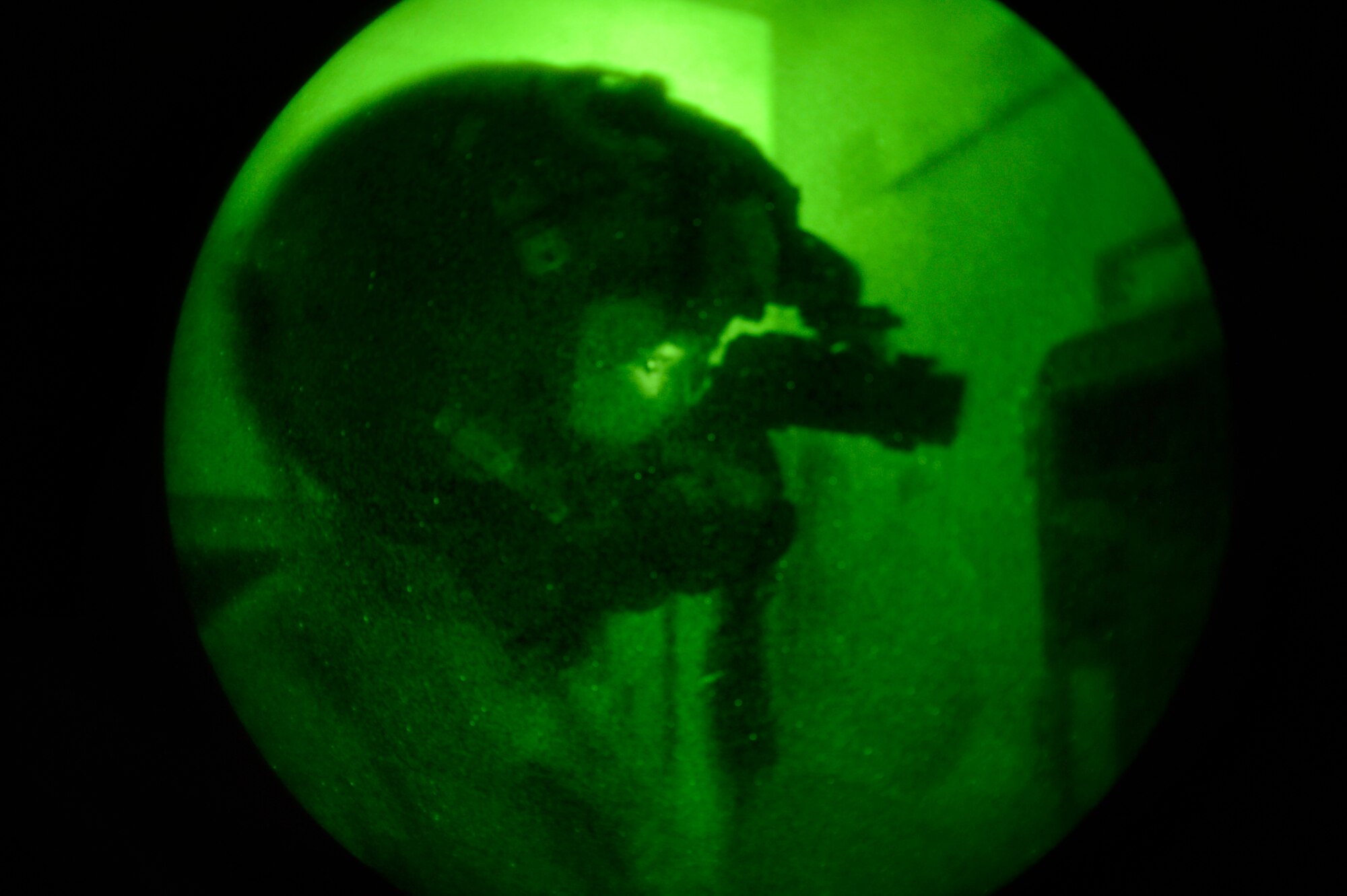 First Lt. Andrew McCoy, 74th Expeditionary Fighter Squadron pilot, performs pre-flight checks on his night-vision Scorpion helmet-mounted cueing system prior to leaving for a mission from Bagram Airfield, Afghanistan, June 17. The Scorpion allows pilots to view targeting data in real time through an eyepiece attached to the helmet itself. (U.S. Air Force photo/ Staff Sgt. Stephenie Wade)