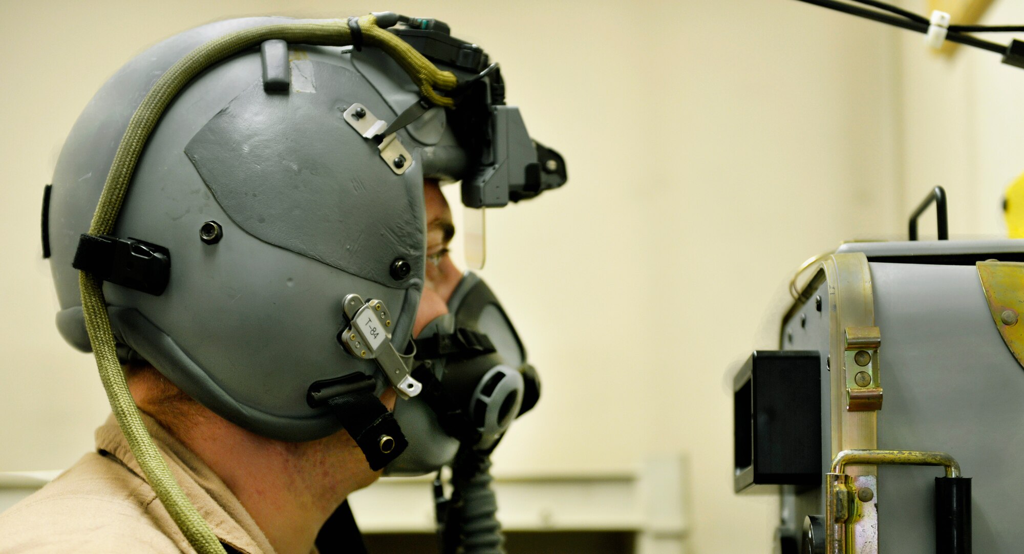 First Lt. Andrew McCoy, 74th Expeditionary Fighter Squadron pilot, performs pre-flight checks on his Scorpion helmet-mounted cueing system prior to leaving for a mission from Bagram Airfield, Afghanistan, June 17. The Scorpion allows pilots to view targeting data in real time through an eyepiece attached to the helmet itself. (U.S. Air Force photo/ Staff Sgt.Stephenie Wade)