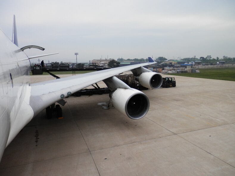 731st Air Mobility Squadron members complete downloading operations on the flight line at Kunsan Air Base, Republic of Korea. The 731st AMS had to transition air freight operations to Kunsan for a projected two-month partial runway closure. (Air Force courtesy photo/Master Sgt. David Hardy)