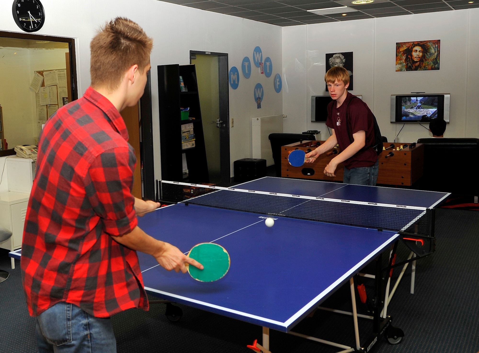 Damian and Shelby Burns, sons of Tech. Sgt. Cherie Burns, 786th Force Support Squadron, play table tennis at the teen center, June 12, 2013, Ramstein Air Base, Germany. The teen center offers teens a variety of programs and recreational activities. (U.S. Air Force photo/Airman 1st Class Trevor Rhynes)