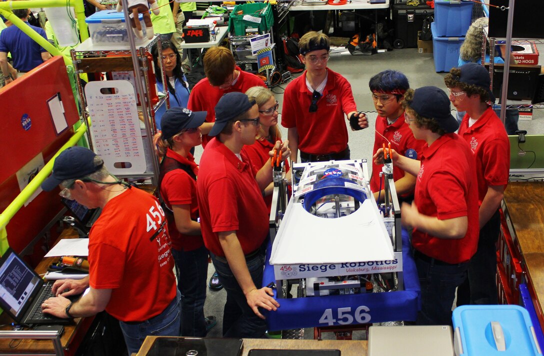 Vicksburg 456 Siege Robotics team members prepare the robot for competitions. 