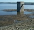 Debris accumulates around Saylorville Lake's control tower and along the dam June 4, 2013.