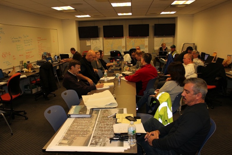 Jacksonville District Emergency Management Chief Aaron Stormant (second from left) works with officials in New York City while coordinating response activities in the aftermath of Hurricane Sandy.  Jacksonville District deployed 20 people to the northeast to assist following the storm.  