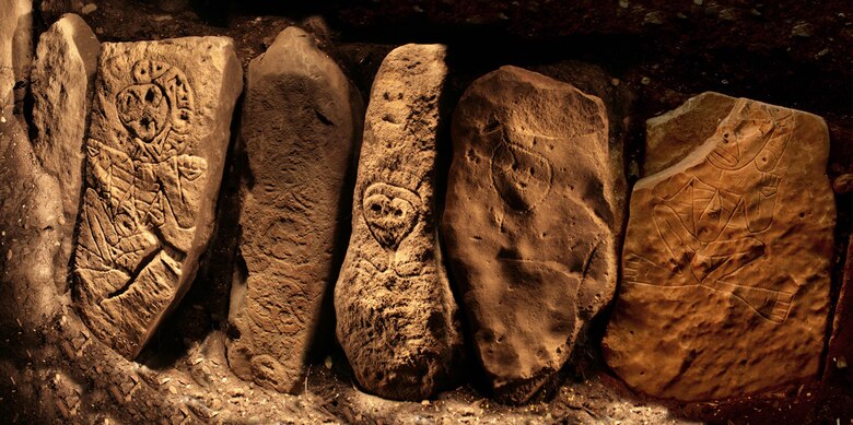 These intricately carved ancient petroglyphs are part of a 60-foot row of well-carved stones discovered at the archaeological site near the Portugues Dam construction site in Ponce, Puerto Rico. 