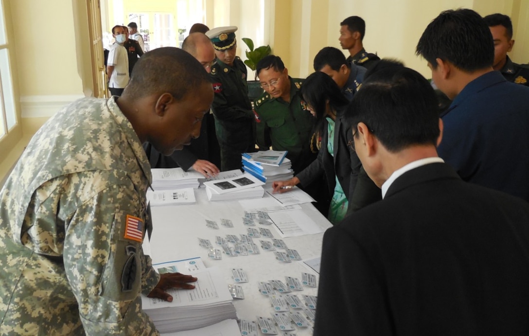 MSG Walter Clay, USARPAC G9, assists participants at the 2013 Lower Mekong Initiative Disaster Response Exercise & Exchange in Phnom Penh, Cambodia. 