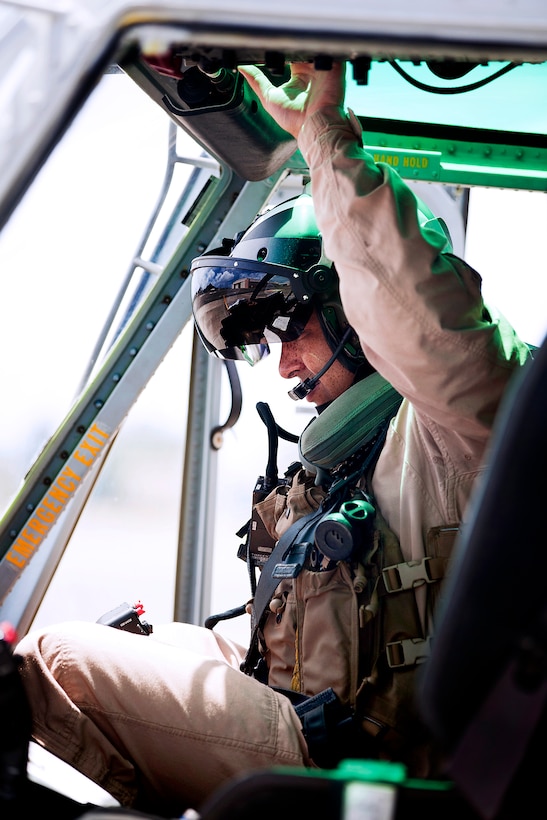 Marine Corps Capt. Harrison Bradford prepares a UH-1Y Huey helicopter for a maintenance and readiness flight on Marine Corps Air Station Kaneohe Bay, Hawaii, June 13, 2013. Bradford, a pilot, is assigned to Marine Light Attack Helicopter Squadron 367.