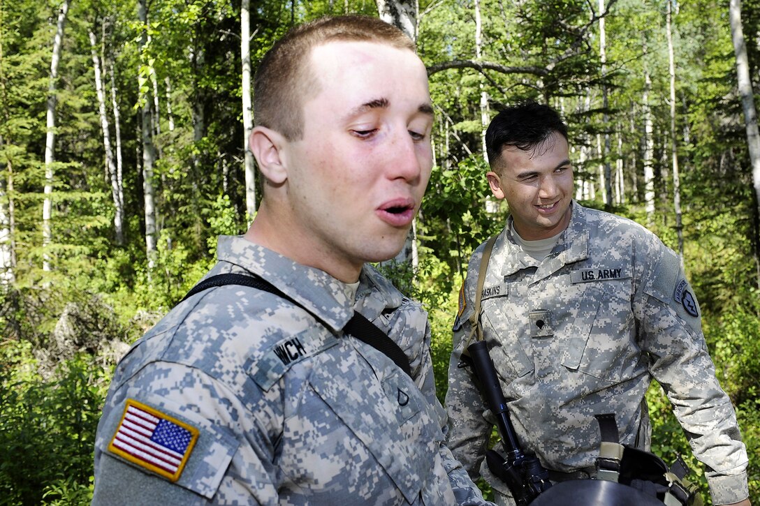 Army Pfc. Christopher Hinch, left, and Army Spc. Joshua Haskins breathe a sigh of relief after exiting the Arctic Nuclear, Biological and Chemical Chamber on Joint Base Elmendorf-Richardson, Alaska, June 17, 2013. Hinch and Haskins are assigned to Company C, 3rd Battalion, Airborne, 509th Infantry Regiment.