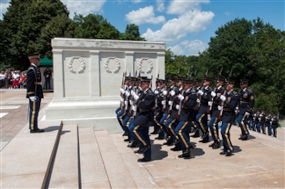 U.S. Army soldiers from the 3rd Infantry Regiment "Old Guard" march up to the Tomb of the Unknown Soldier for a wreath laying ceremony in commemoration of the Army's 238th Birthday in Arlington National Cemetery, Va., on June 14, 2013.  Secretary of the Army John McHugh, U.S. Army Chief of Staff Gen. Ray Odierno and Sergeant Major of the Army Sgt. Maj. Raymond F. Chandler III will lay the wreath.  
