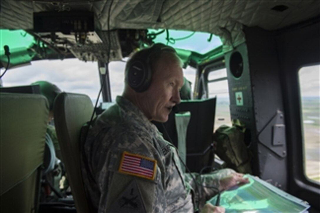 Chairman of the Joint Chiefs of Staff Gen. Martin E. Dempsey is given a helicopter tour of the Minuteman III missile launch facilities at Minot Air Force Base, N.D., on June 17, 2013.  Dempsey is visiting Minot to observe the Air Force Nuclear Triad operations and to talk to airmen assigned to the base.  
