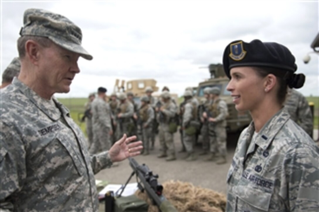 Chairman of the Joint Chiefs of Staff Gen. Martin E. Dempsey talks with Air Force Security Forces personnel at Minot Air Force Base, N.D., on June 17, 2013.  Dempsey is visiting Minot to observe the Air Force Nuclear Triad operations and to talk to airmen assigned to the base.  