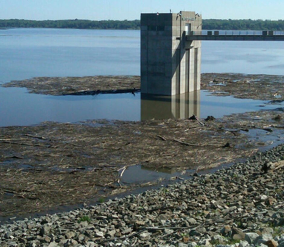 Debris accumulates around Saylorville Lake's control tower and along the dam June 4, 2013.