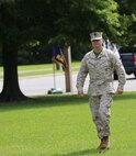 Navy Capt. Cameron L. Waggoner, the commanding officer of 2nd Medical Battalion, 2nd Marine Logistics Group, assumes his role as reviewing officer during a change of command ceremony aboard Camp Lejeune, N.C., June 18, 2013. Waggoner relieved one master chief petty officer of his post and appointed a new one in this traditional ceremony, complete with the passing of a Navy cutlass. (U.S. Marine Corps photo by Lance Cpl. Shawn Valosin)