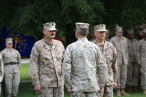 Command Master Chief Petty Officer Christopher L. Hill (left) was relieved of his post by Navy Capt. Cameron L. Waggoner (center), the commanding officer of 2nd Medical Battalion, 2nd Marine Logistics Group, aboard Camp Lejeune, N.C., June 18, 2013. Master Chief Petty Officer Michael J. Roberts (right) will be the new command master chief for the battalion.  (U.S. Marine Corps photo by Lance Cpl. Shawn Valosin)