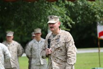 Master Chief Petty Officer Christopher L. Hill, the outgoing command master chief petty officer for 2nd Medical Battalion, 2nd Marine Logistics Group, gives a speech during a changing of command ceremony aboard Camp Lejeune, N.C., June 18, 2013. Hill passed command to Master Chief Petty Officer Michael J. Roberts after serving with the battalion for four years. (U.S. Marine Corps photo by Lance Cpl. Shawn Valosin)