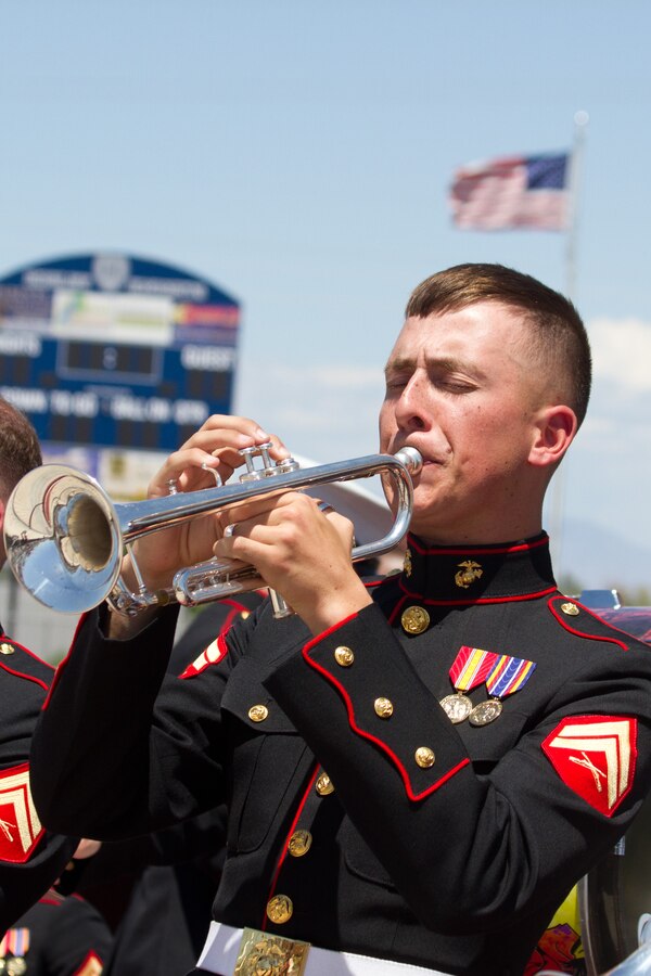 A Marine Band San Diego trumpet player performs during a concert the band played at Higley High School in Gilbert, Ariz., May 11, 2013. The 25-member band out of Marine Corps Recruit Depot San Diego highlighted their show with a performance of Bruno Mars’ “Locked out of Heaven.” The purpose of the concert, hosted by Marine Corps Recruiting Station Phoenix and the Higley Unified School District, was to entertain and show a viable option the Marine Corps has to offer aspiring musicians. Marine Band San Diego nationally performs more than 400 concerts annually. (U.S. Marine Corps photo by Sgt. Tyler J. Bolken)