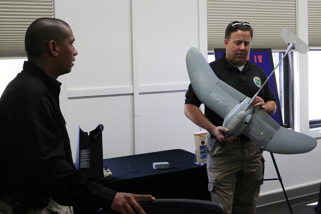 Dean McCoy, an unmanned aircraft system commodity management specialist, holds a Small Unmanned Aircraft System during the official opening of the Training and Logistics Support Activity-West at Camp Pendleton, June 18. The TALSA provides Marines with a central location where they can receive Group I SUAS training on new equipment and sustainment training.