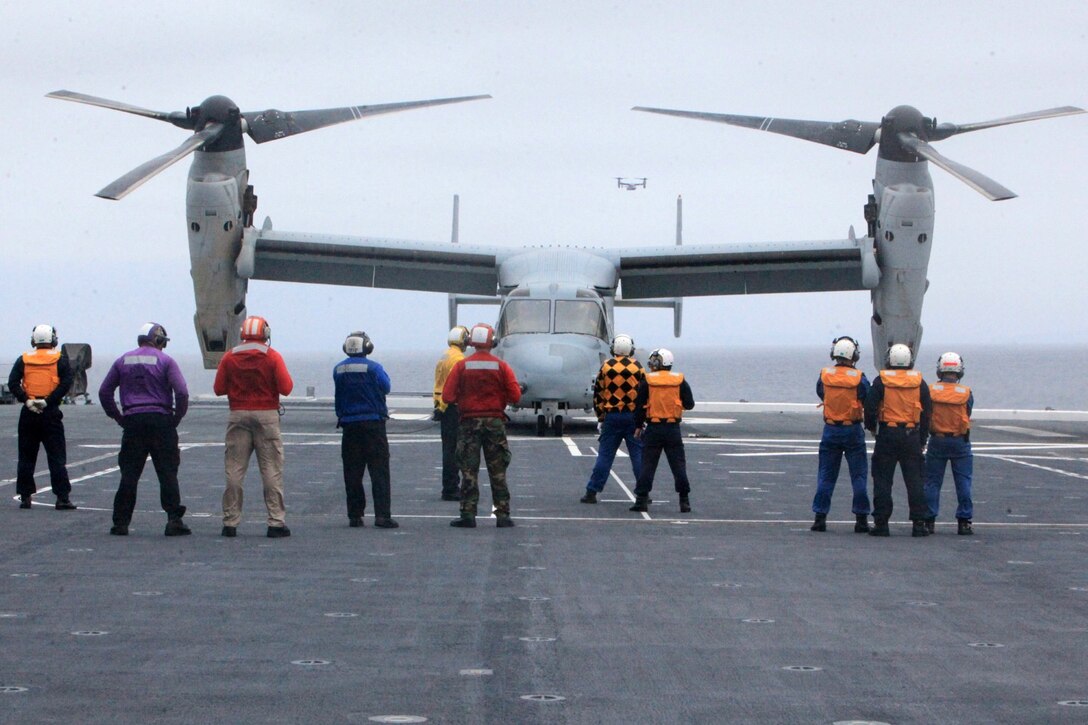 An MV-22B Osprey from Marine Medium Tiltrotor Squadron 161 (VMM-161) lands onboard the JS Hyuga (DDG-181), during Dawn Blitz 2013 for the first time in history off the coast of Naval Base Coronado, June 14. Exercise Dawn Blitz 2013 is a multinational amphibious exercise off the Southern California coast that refocuses Navy, Marine Corps and coalition forces in their ability to conduct complex amphibious operations essential for global crisis response across the range of military operations.