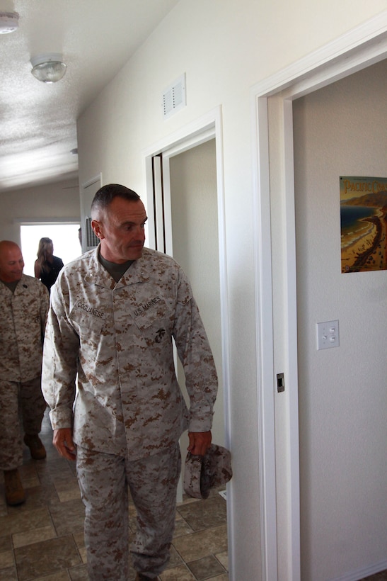Brig. Gen. Vincent A. Coglianese takes a tour of one of the four new beach cottages at San Onofre Beach after giving opening comments at a dedication ceremony held June 18. Coglianese is the commanding general of the base and regional authority for five Marine Corps Installations in the southwestern United States. The Cottages are for the recreational use of Marines, sailors and their families.