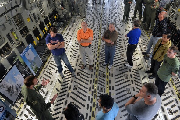 Maj. Matt Armstrong, 62nd Airlift Wing commander’s action group chief, briefs a group from AmericanDreamU, on Operation Deep Freeze, June 20, 2013 at Joint Base Lewis-McChord, Wash. The group learned about the I Corps and 62nd AW’s missions during their visit. (U.S. Air Force photo/Airman 1st Class Jacob Jimenez) 