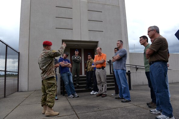 Capt. Joshua Barlow, 22nd Special Tactics Squadron special tactics officer, briefs a group from AmericanDreamU, on the responsibilities of combat controllers during a tour June 20, 2013 at Joint Base Lewis-McChord, Wash. AmericanDreamU is a program for servicemembers that helps them find their dream job or build their own business. (U.S. Air Force photo/Airman 1st Class Jacob Jimenez)  