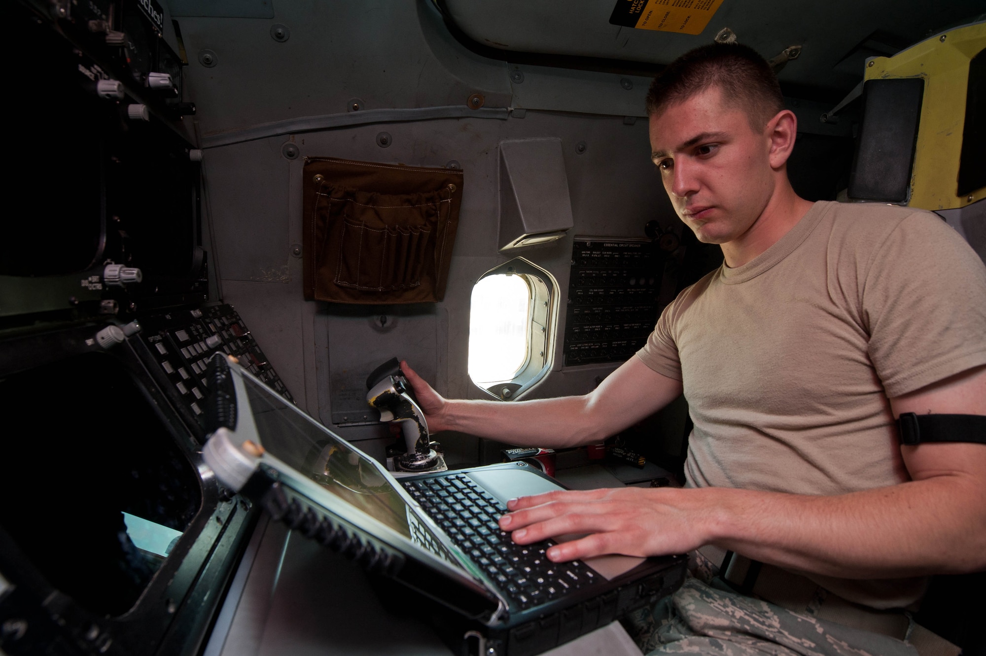 Airman 1st Class Jeffrey Merrill, 28th Aircraft Maintenance Squadron offensive avionic systems specialist, inspects the central integrated test system controls in a B-1 bomber during routine maintenance at Ellsworth Air Force Base, S.D., June 18, 2013. The CITSC affects the B-1’s navigation, communication, sniper pod, GPS and radar abilities. (U.S. Air Force photo by Airman 1st Class Zachary Hada/Released)