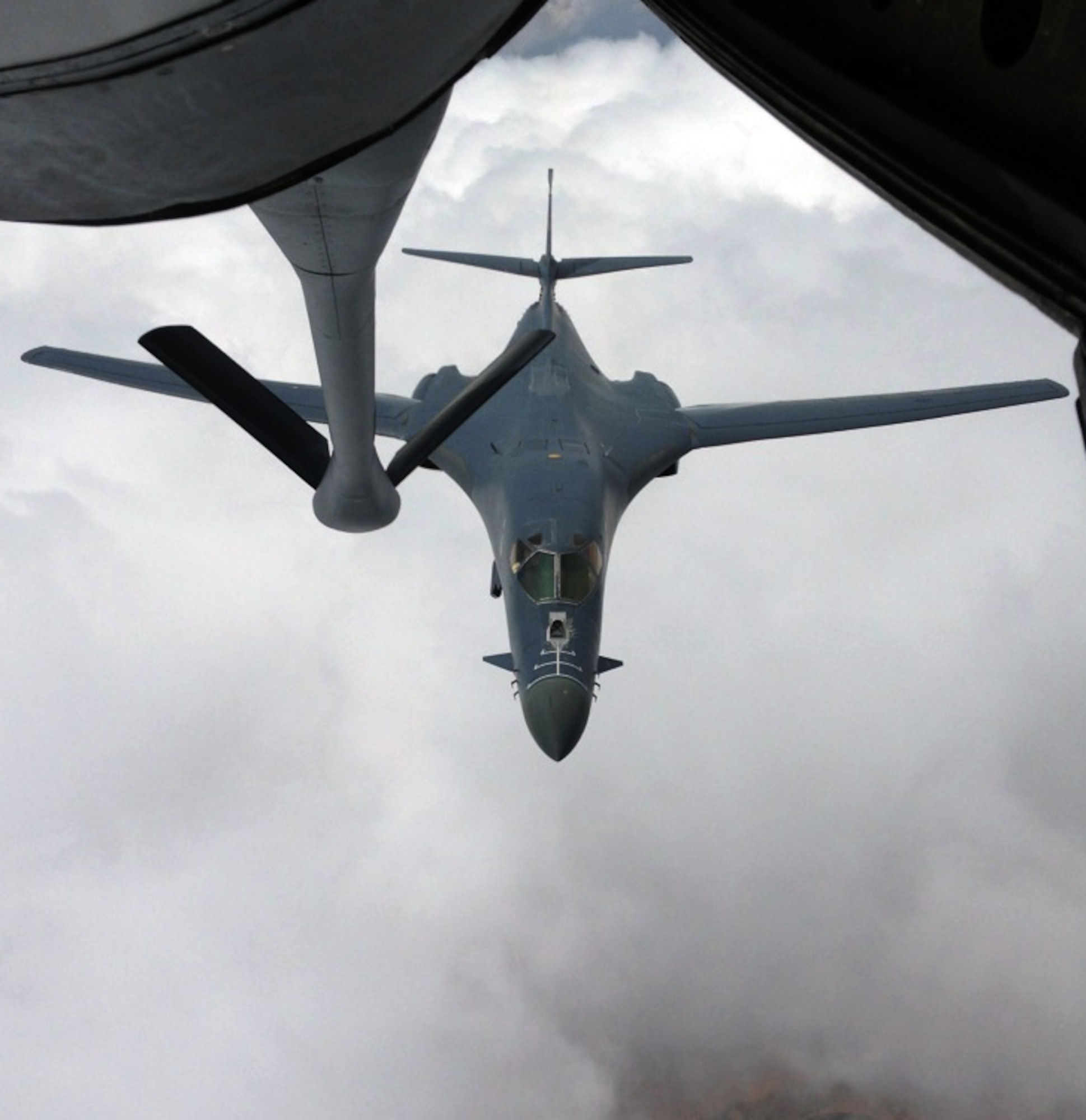 A B-1B Lancer assigned to the 7th Bomb Wing, Dyess Air Force Base, Texas, approaches the refueling boom of a KC-135 Stratotanker from McConnell Air Force Base, Kan., during an air refueling training mission June 20, 2013.  The KC-135 was being operated by an aircrew made up of members of the Air Force Reserve 18th Air Refueling Squadron, 931st Air Refueling Group at McConnell.  Air refueling training missions are essential to keeping aicrew members proficient in all aspects of air refueling operations.  (U.S. Air Force photo by Senior Master Sgt. Ray Lewis)
