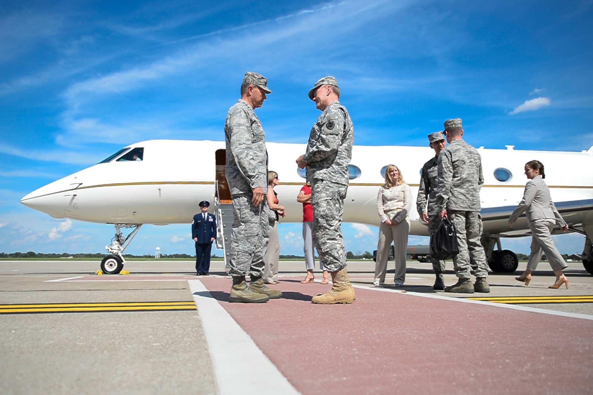 Air Force Gen. William M. Fraser III, left, commander of U.S. Transportation Command, and Army Gen. Martin E. Dempsey, chairman of the Joint Chiefs of Staff, talk on Scott Air Force Base, Ill., June 19, 2013. (DOD photo/D. Myles Cullen) 