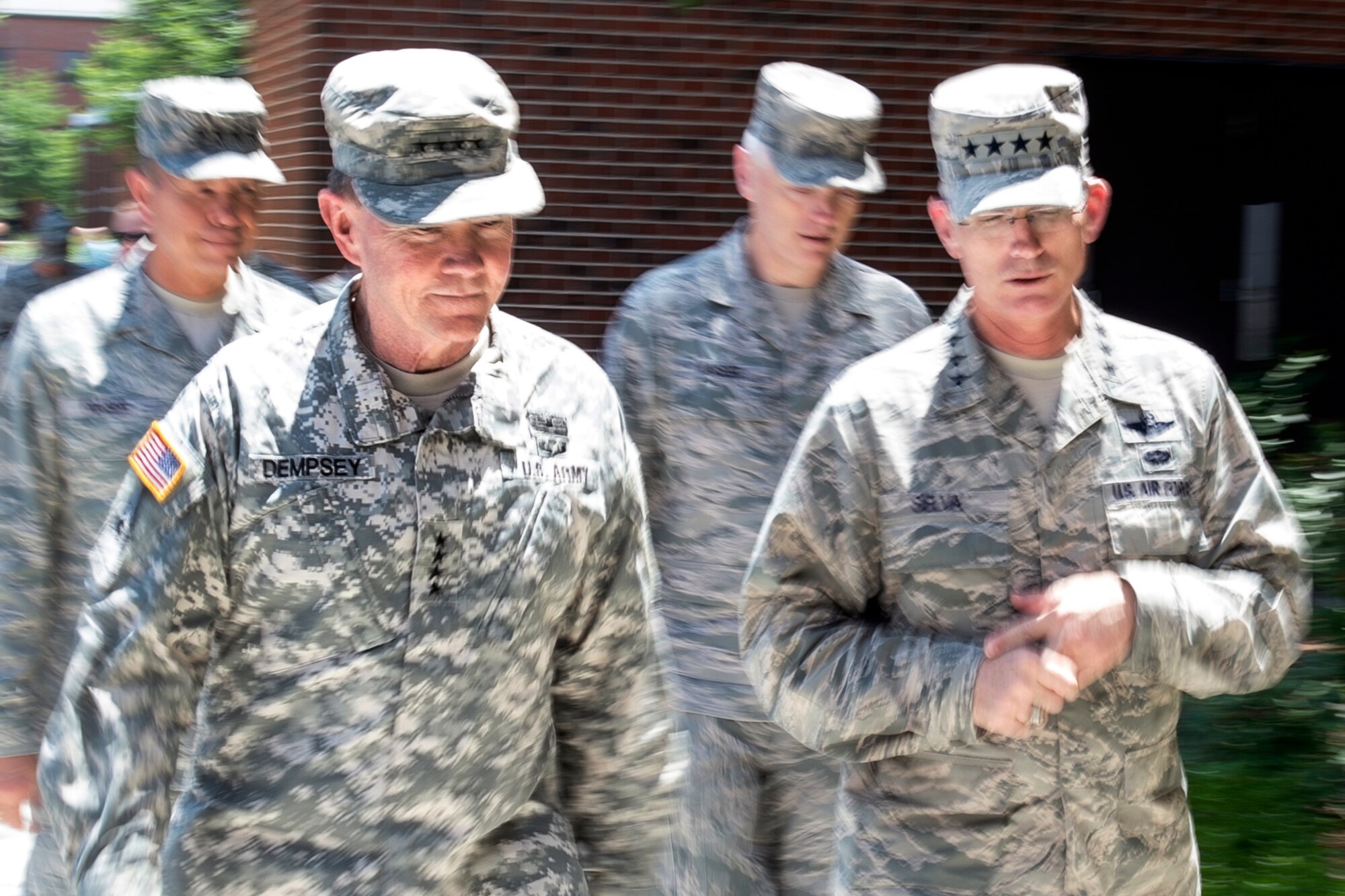 Air Force Gen. Paul J. Selva, right, commander of Air Mobility Command, briefs Army Gen. Martin E. Dempsey, left, chairman of the Joint Chiefs of Staff, on Scott Air Force Base, Ill., June 19, 2013. (DOD photo/D. Myles Cullen) 