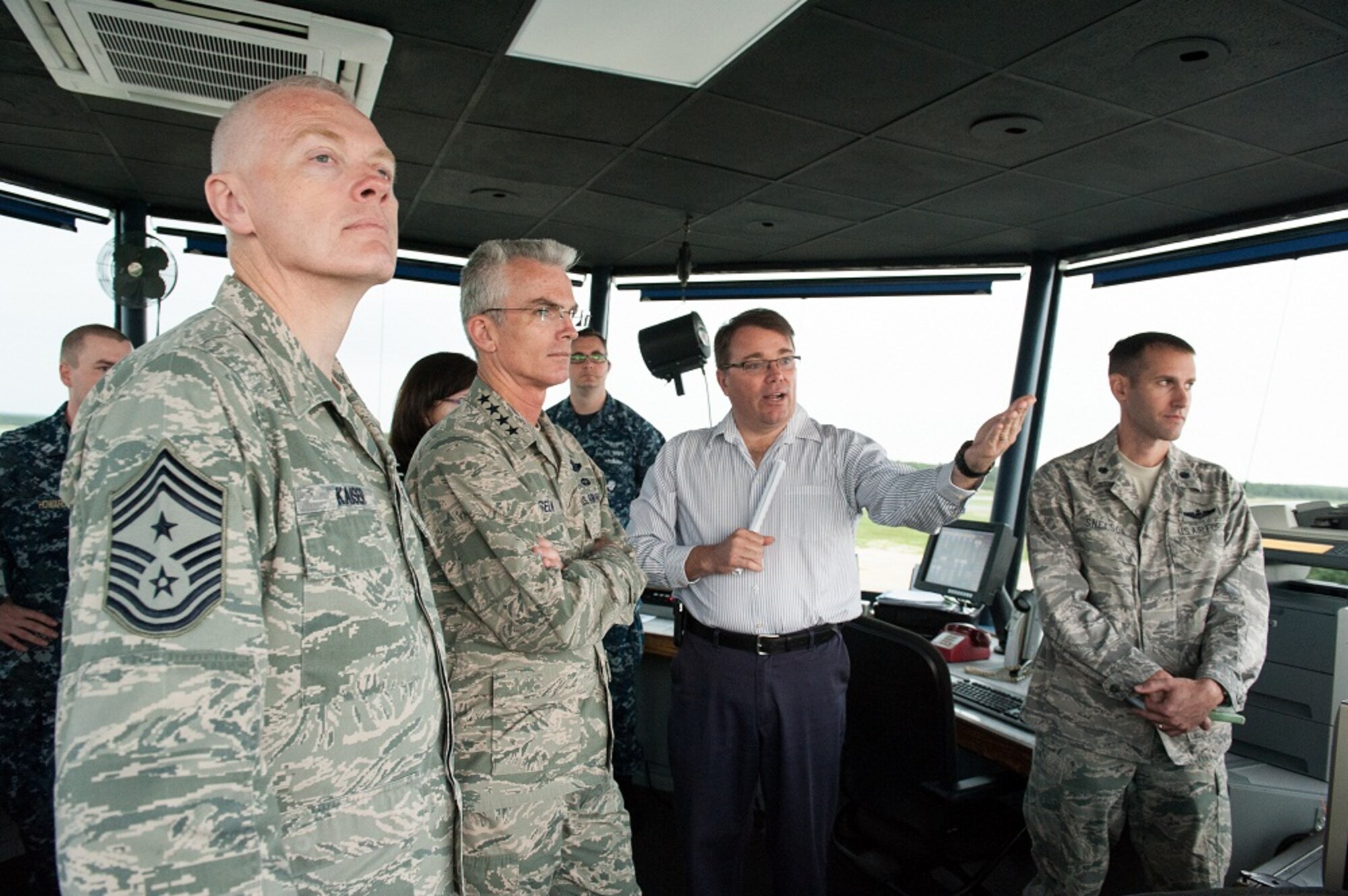 Air traffic controllers brief Gen. Paul J. Selva, Air Mobility Command commander, on the control tower operations June 13, 2013, at Joint Base McGuire-Dix-Lakehurst, N.J. Selva visited and toured various areas at JB MDL for three days to familiarize himself with the joint base’s mission and operations. (U.S. Air Force photo by Russ Meseroll/Released)