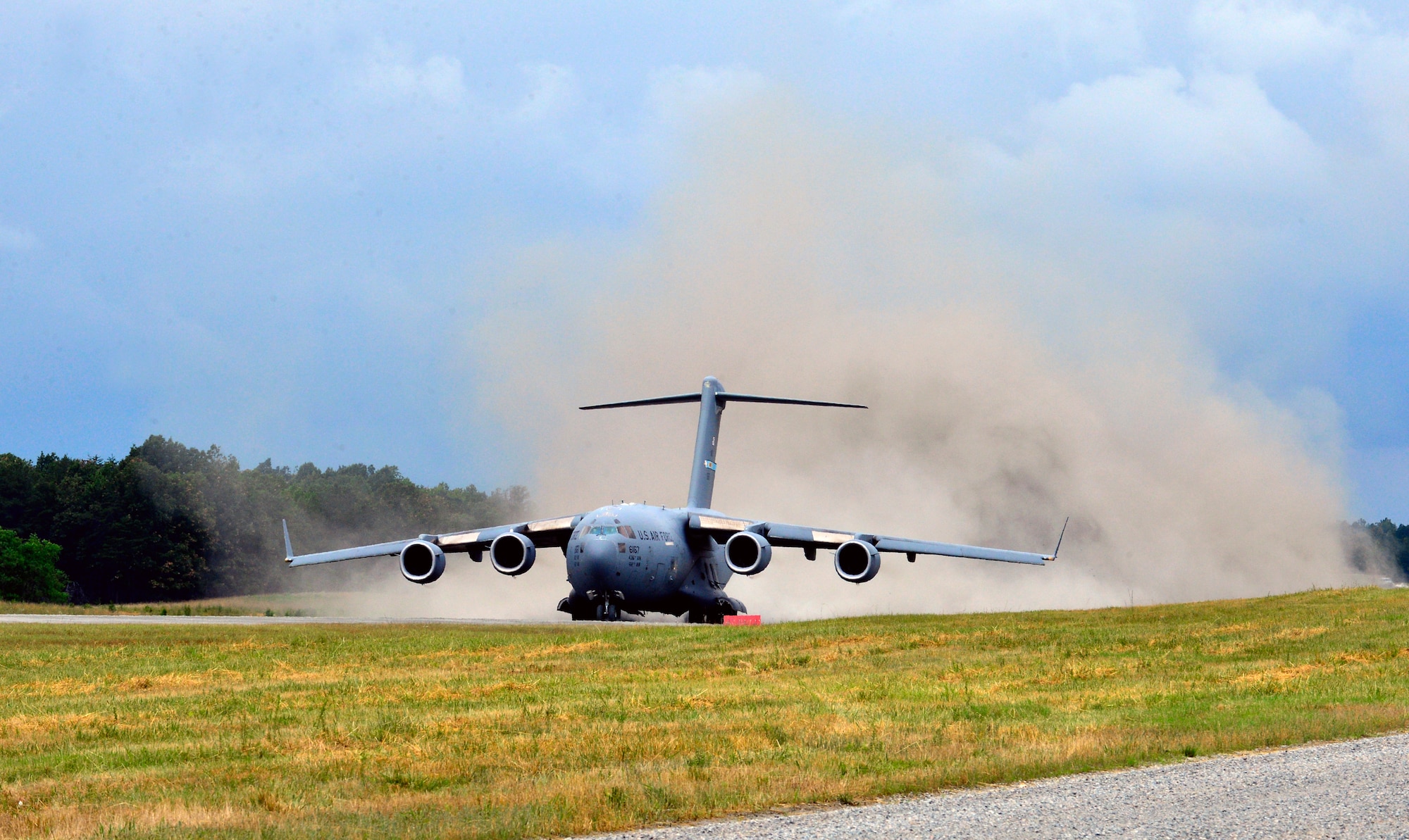 A C-17 Globemaster III, from the 3rd Airlift Squadron Dover Air Force Base Del. takes off from the semi-prepared runway, June 19, 2013 at Fort A.P. Hill, Va. SPRO training prepares aircrews to operate the C-17 in austere, rugged runway conditions to deliver troops, equipment and military hardware to a forward deployed battle-field. (U.S. Air Force photo/David S. Tucker) 
