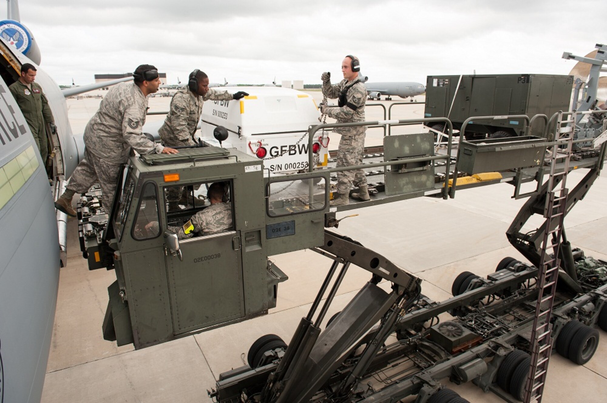 Members of the 305th Operations Support Squadron load equipment onto a
KC-10 Extender  June 13, 2013, at Joint Base McGuire-Dix-Lakehurst,
N.J. The boom operators practiced loading and unloading equipment on a
replicated KC-10 engine to keep them current on procedures. (U.S. Air
Force photo by Russ Meseroll/Released)