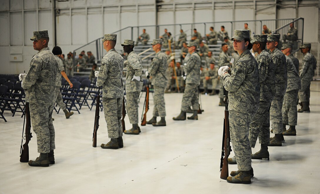 Airmen from the Air Force Honor Guard stand by as they rehearse for the Secretary of the Air Force Farewell Ceremony on Joint Base Andrews, Md., June 20, 2013. The ceremony will take place on June 21, where the SecAF , Michael B. Donley, will relinquish his position and retire. (U.S. Air Force photo/Senior Airman Lauren Main)