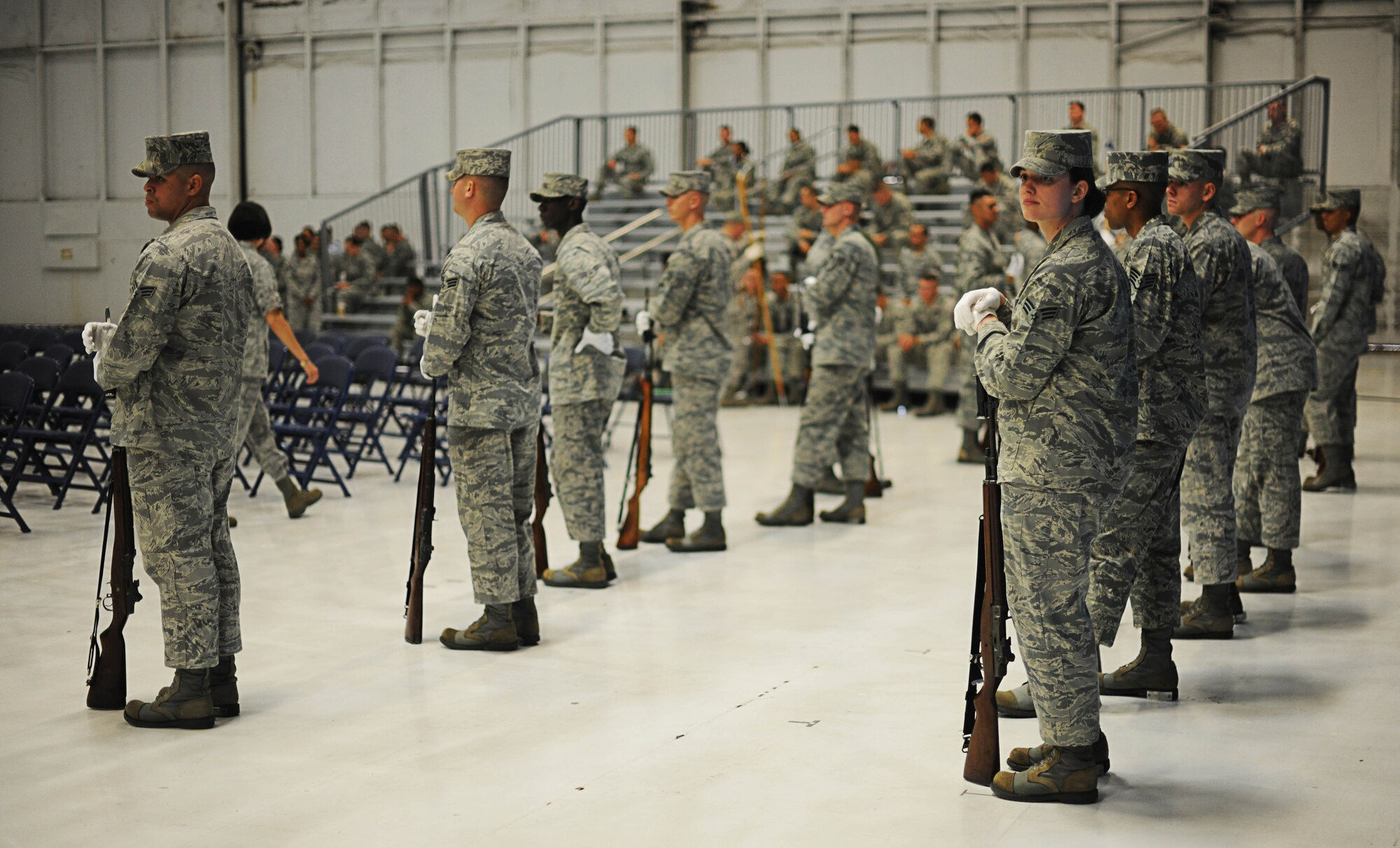 Airmen from the Air Force Honor Guard stand by as they rehearse for the Secretary of the Air Force Farewell Ceremony on Joint Base Andrews, Md., June 20, 2013. The ceremony will take place on June 21, where the SecAF , Michael B. Donley, will relinquish his position and retire. (U.S. Air Force photo/Senior Airman Lauren Main)