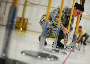 Airman 1st Class Amber Wiseman,11th Civil Engineering Squadron pest management apprentice, aligns the state flags in preparation for the Secretary of the Air Force Farewell Ceremony at Joint Base Andrews, Md., June 20, 2013. The ceremony will take place in on June 21, where the SECAF , Michael B. Donley, will relinquish his position and retire. (U.S. Air Force photo/Senior Airman Lauren Main)