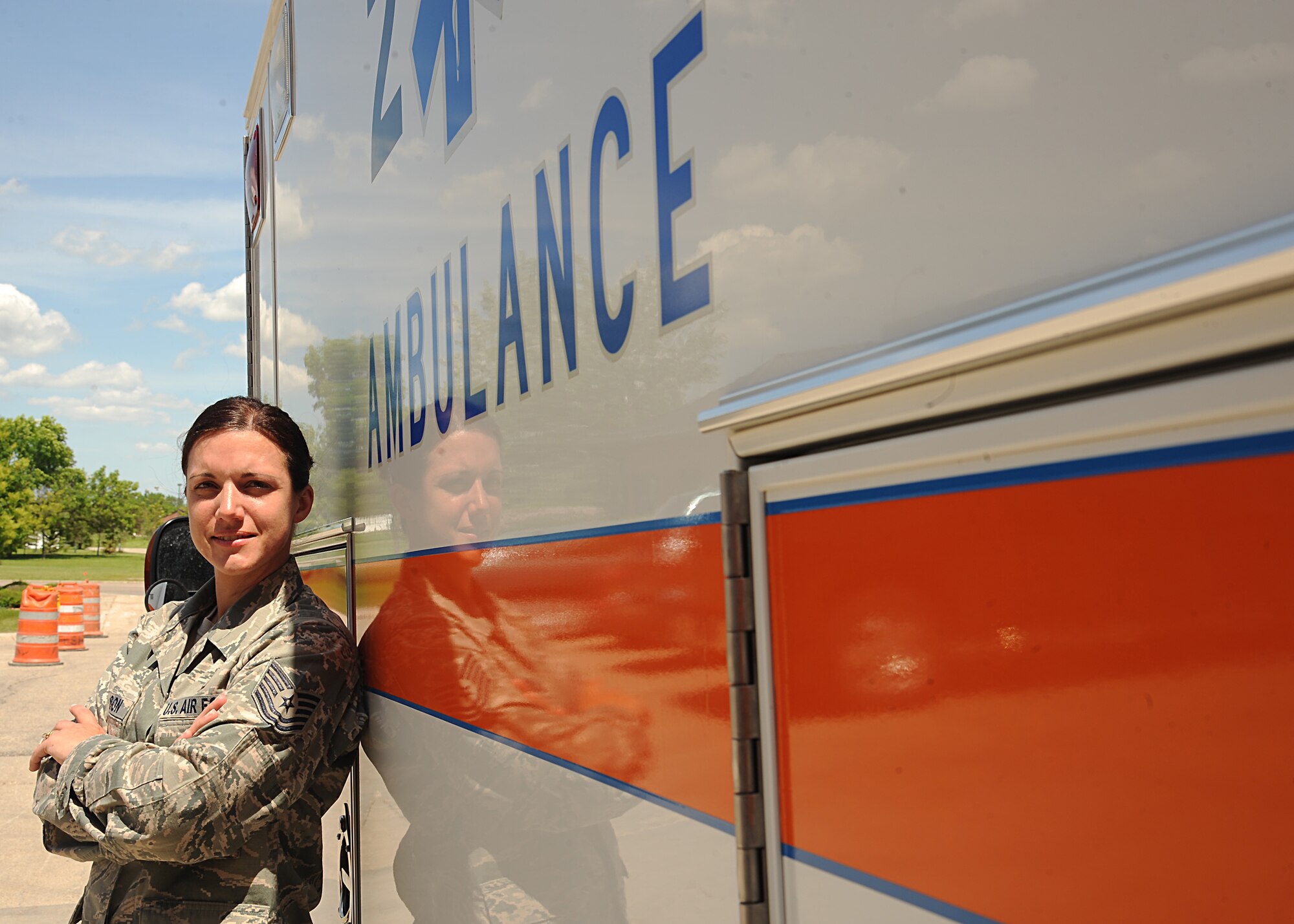 Tech. Sgt. Jennifer Ellison, 319th Medical Operations Squadron, stands next to an MDG ambulance on June 19, 2013, on Grand Forks Air Force Base, N.D. Ellison was named the Warrior of the Week for the third week of June. (U.S. Air Force Photo/Airman 1st Class Xavier Navarro)