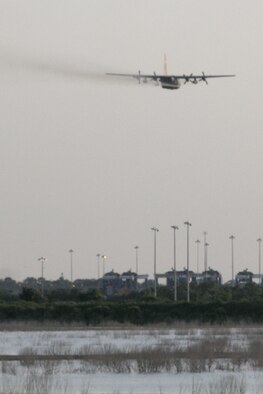 Joint Base Charleston – Weapons Station, S.C. – A specially-modified Air Force Reserve C-130 Hercules tactical cargo aircraft, assigned to the 910th Airlift Wing, based at Youngstown Air Reserve Station, Ohio, disperses a water-diluted EPA-approved insecticide over an area known as the spoils site here, June 15, 2013. The 30-acre ‘spoils site’ is known to produce approximately 40-million mosquitoes per acre, or 1.2 billion of the pest insects, annually. The 910th’s Aerial Spray Unit conducted spraying operations here, June 15, 2013 to control the population of the disease-carrying pest insects at the installation. The 910th sprayed approximately 16,500 acres to provide much sought relief for the base’s populace. The 910th’s 757th Airlift Squadron is home to the Department of Defense’s only large-area, fixed-wing aerial spray capability. U.S. Air Force photo by Tech. Sgt. Rick Lisum.